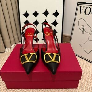 Valentino Garavani Black Leather Slingback Pumps with Gold V Logo